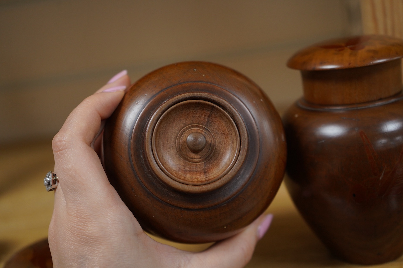 A pair of 18th century lacquered pear wood tea caddies, as seen in Pinto's book, page 293 and plate 315 (D), 12.5cm tall. Condition - repairs to covers, some wear to lacquer